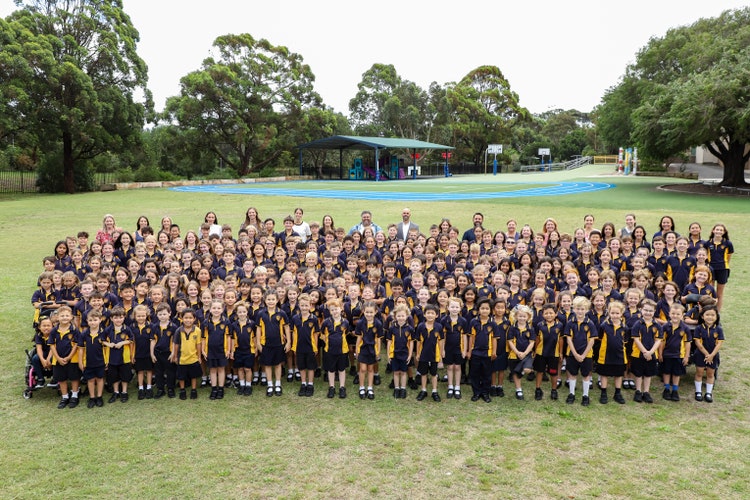 Staff and students of BPS gathered on the school playground