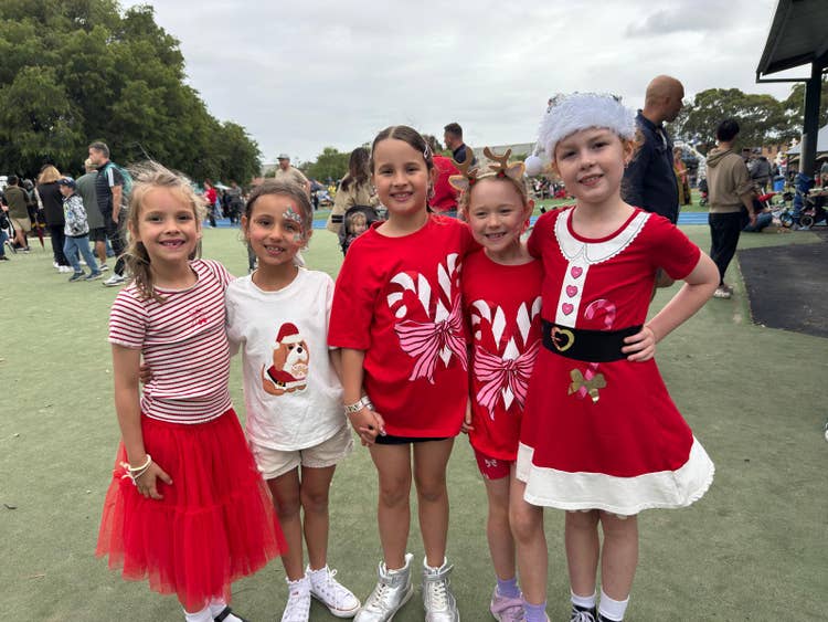 5 Stage 1 girls, wearing Christmas outfits at teh BPS Christmas Festival