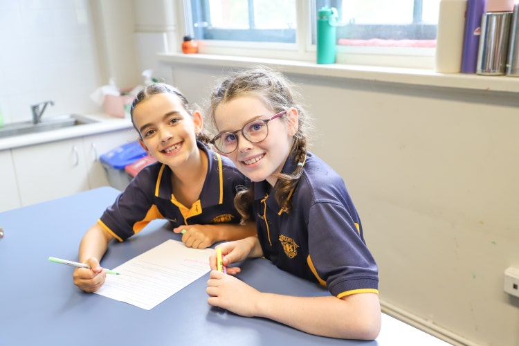 2 Stage 2 students working together in a classroom