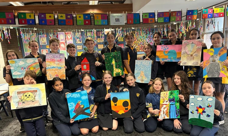 Stage 3 students proudly display their artworks